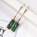 Green lantern pendant earrings in gold – refined style