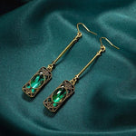 Green lantern pendant earrings in gold – refined style