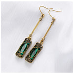 Green lantern pendant earrings in gold – refined style