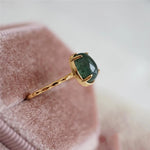 Green teardrop luxury ring in gold – statement design