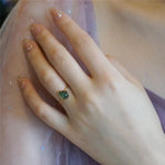 Green teardrop luxury ring in gold – statement design