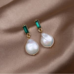 Luxurious gold earrings with pearls and green zirconia – refined style
