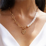 Crossed heart pendant with pearls in gold – Romantic detail