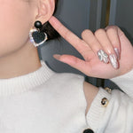 Dark heart earrings in gold – Bold romance