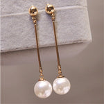 Luxurious dangling earrings with special hand-set pearls – Elegant movement