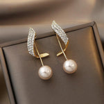 Pearl earrings in gold – Classic elegance