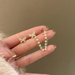 Butterfly pendant earrings with pearls and zirconia in gold – refined style