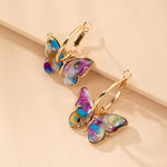 Acrylic butterfly earrings in gold – modern elegance