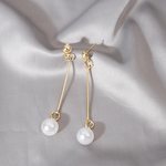 Luxurious dangling earrings with special hand-set pearls – Elegant movement